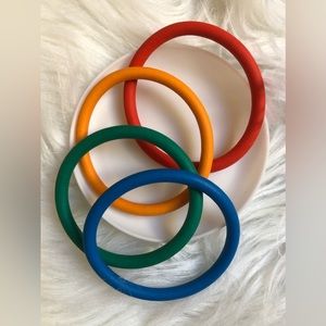 Four bright stretchy bangle bracelets